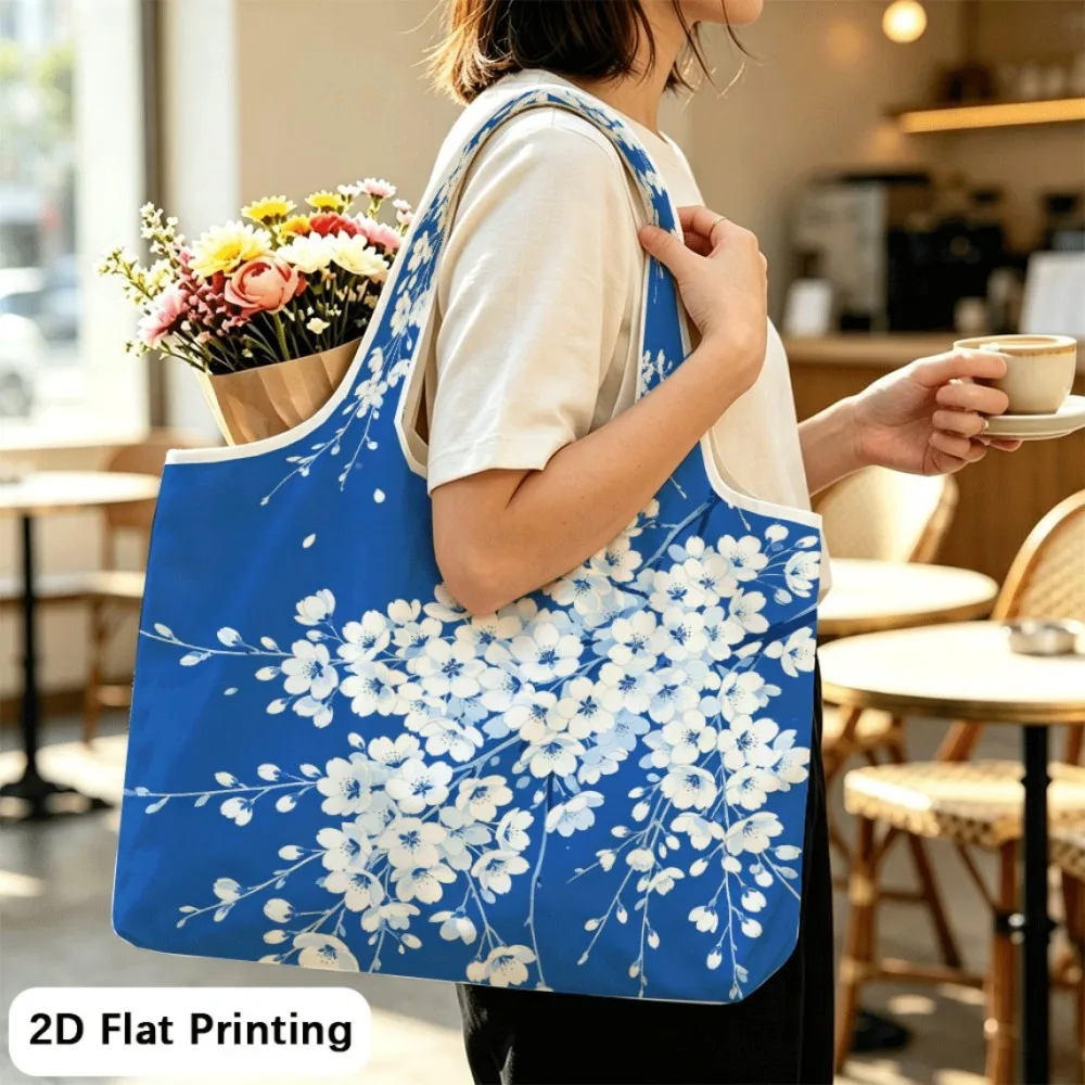 Blue Hanging Cherry Durable foldable tote shoulder bag, holds books and travel items.