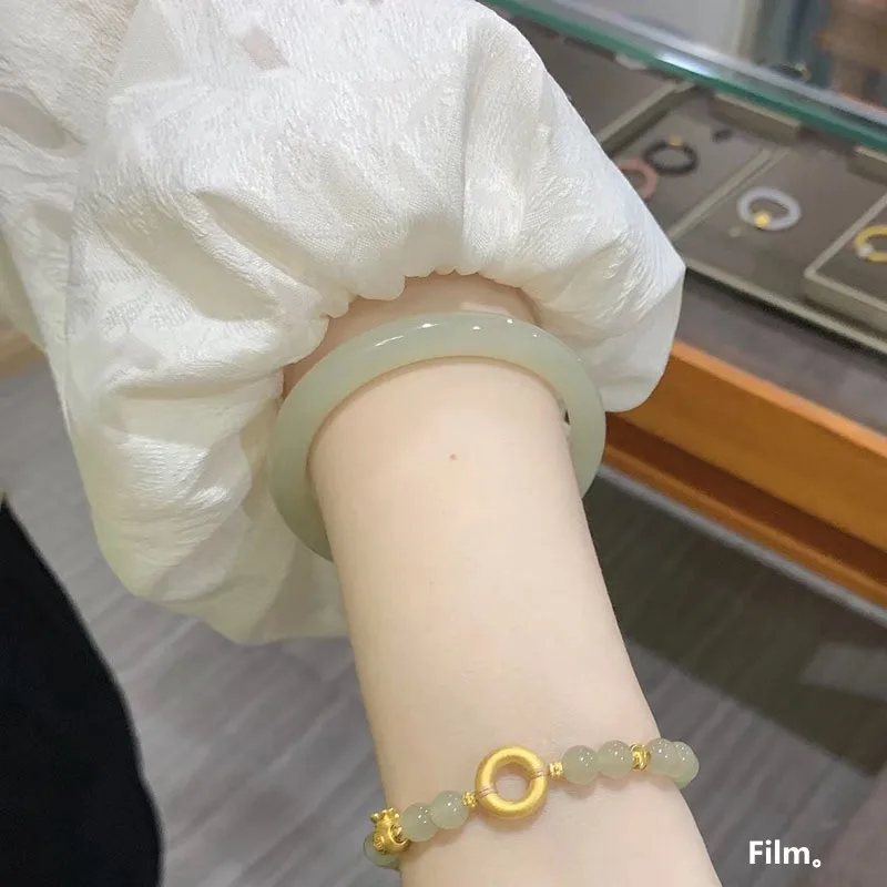 Hetian jade, a fine, round, and slender bracelet made of Qingbai jade, featuring a clear and bright color, a delicate design, an