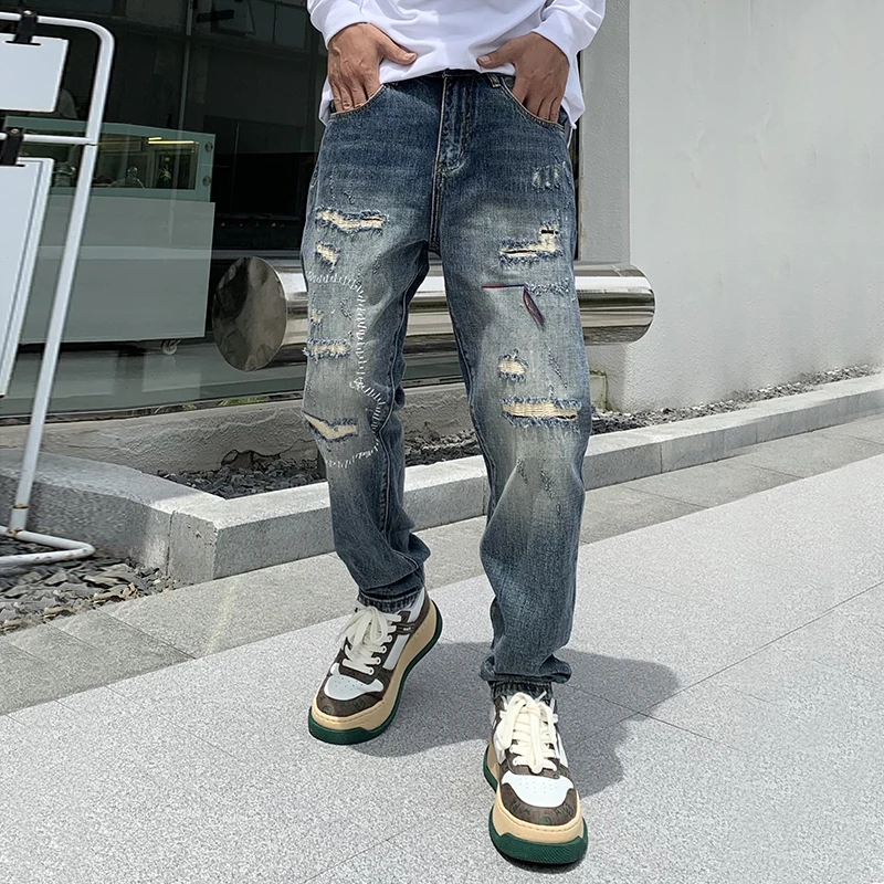 High-end personalized broken holes patch embroidery jeans men Trendy versatile fall high street tapered new pants　