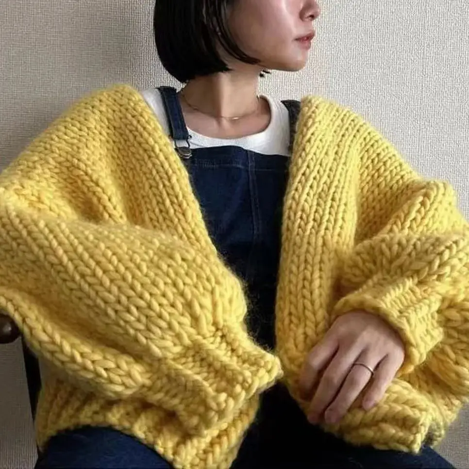 V-neck women\'s cardigan wool sweater with large yellow bubble sleeves, comfortable and soft mohair hand woven autumn new style