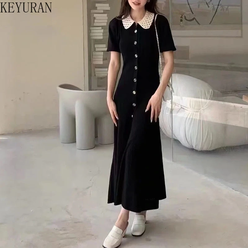 

Французское кружевное трикотажное платье с крючками, женское лето 2025, новый стиль, элегантное черное облегающее длинное платье с лацканами, женские платья