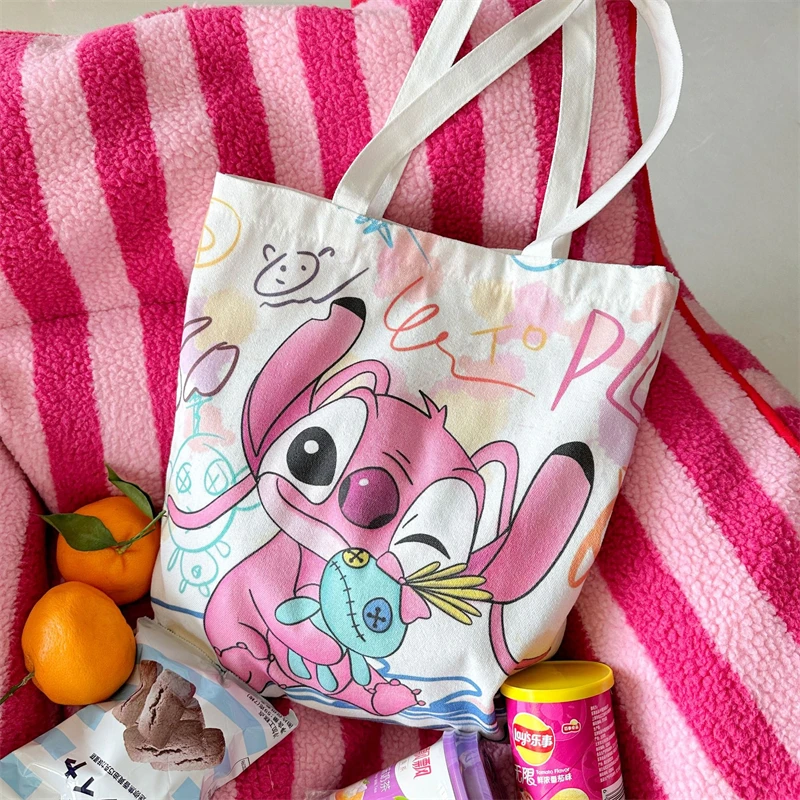 Borsa di tela Disney Stitch Cute Cartoon Angel Fashion borsa per lo Shopping portatile ad alta capacità borsa a tracolla fresca regali di festa