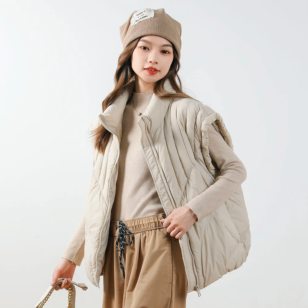 سترة مقصوصة على الطراز الكوري. مصنوعة من بطة بيضاء بنسبة 90% للدفء خفيفة الوزن وصورة ظلية حديثة ومرحلة.