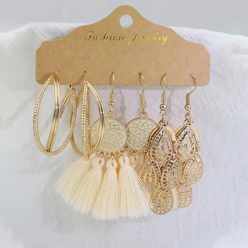 Fashionable and Versatile Retro Hollow-Out Earrings, Bohemian-Style Tassel Leaf-Shaped Pendant Accessories. Fashionable and Versatile Gold Hoops with Trendy White Tassels, Designed Specifically for Women, Suitable for Daily Wear, Showcasing a Fresh Style