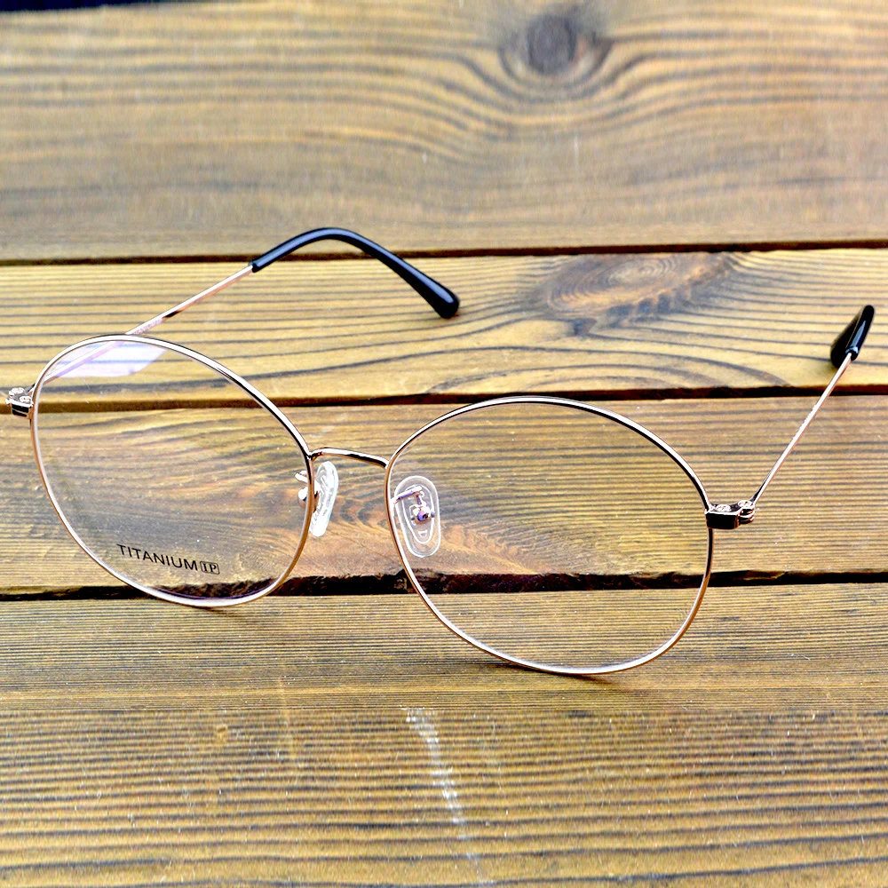 إطار نظارات بصرية دائرية كلاسيكية مطلي بسبائك التيتانيوم مع لمسة نهائية من الذهب الوردي