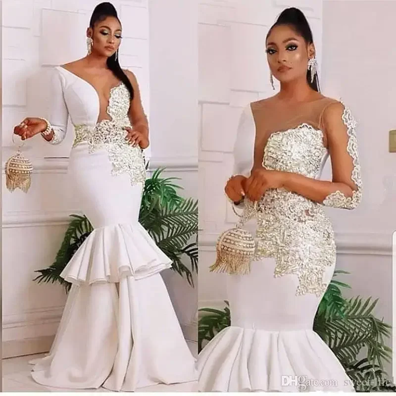 Vestidos de novia de sirena nigeriana africana personalizados, apliques de encaje con cuello transparente, mangas largas, vestidos de novia con múltiples volantes de talla grande