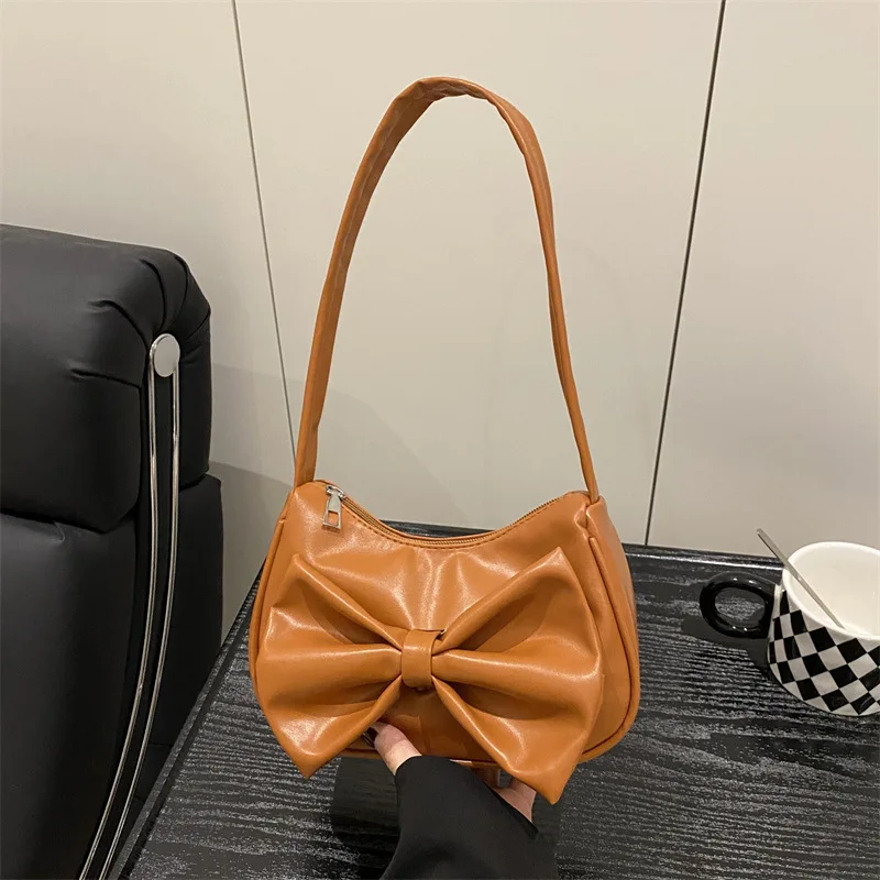 

Новая элегантная и милая сумка в корейском стиле 2025 года, модная однотонная сумка через плечо большой вместимости с бантом под мышками