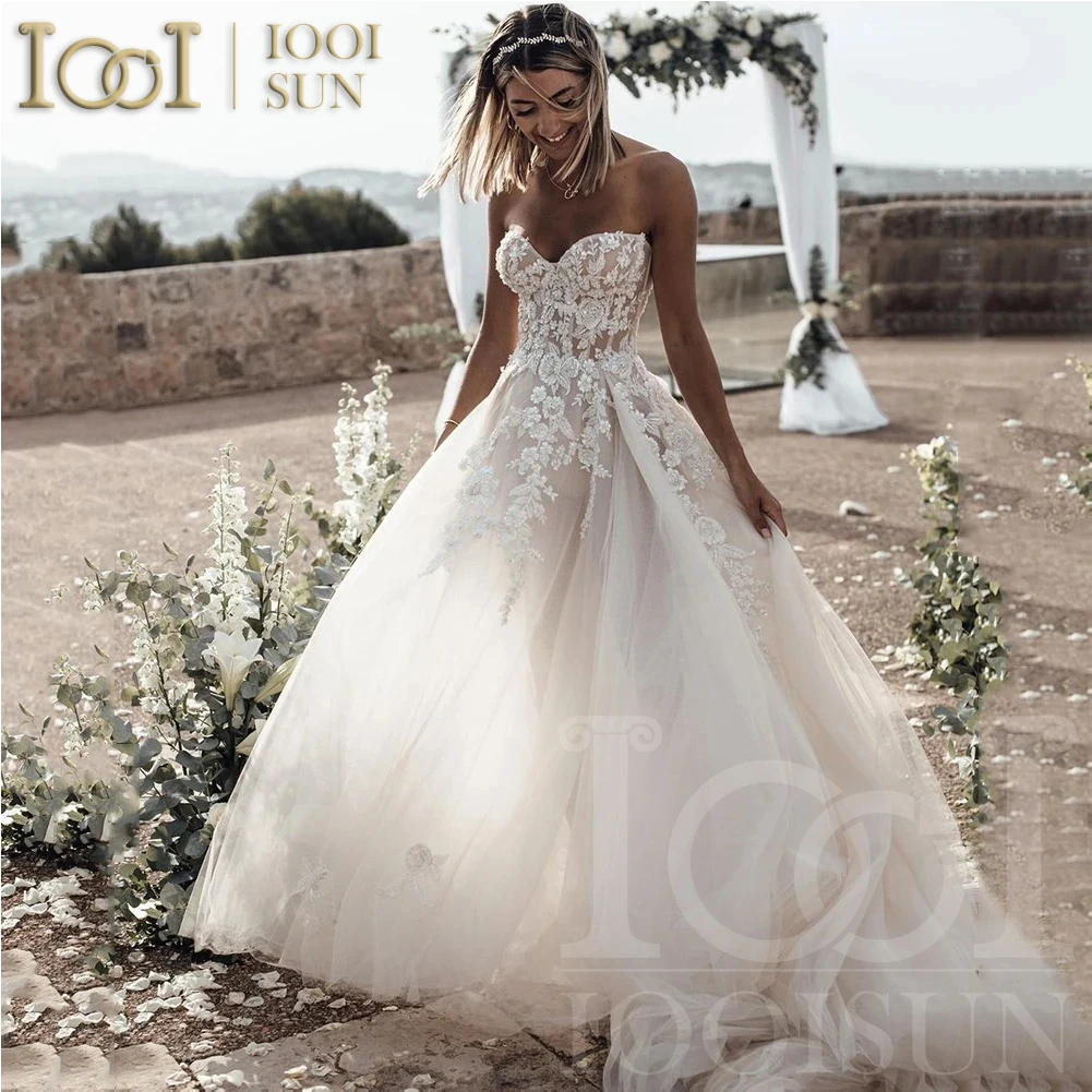 IOOISUN Boho Breathtaking Strapless Wedding Dress Featuring Stunning Lace Appliques and Flowy A-Line Bridal Dress Customized