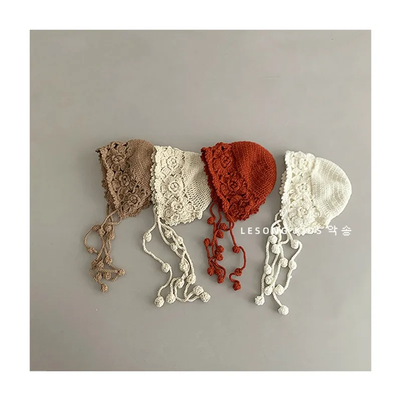 

Autumn and Winter Handmade Hollow-Out Knitted Children's Wool Hat, Stylish Warm Earflap Hat with Cute Tassels for Baby Girls