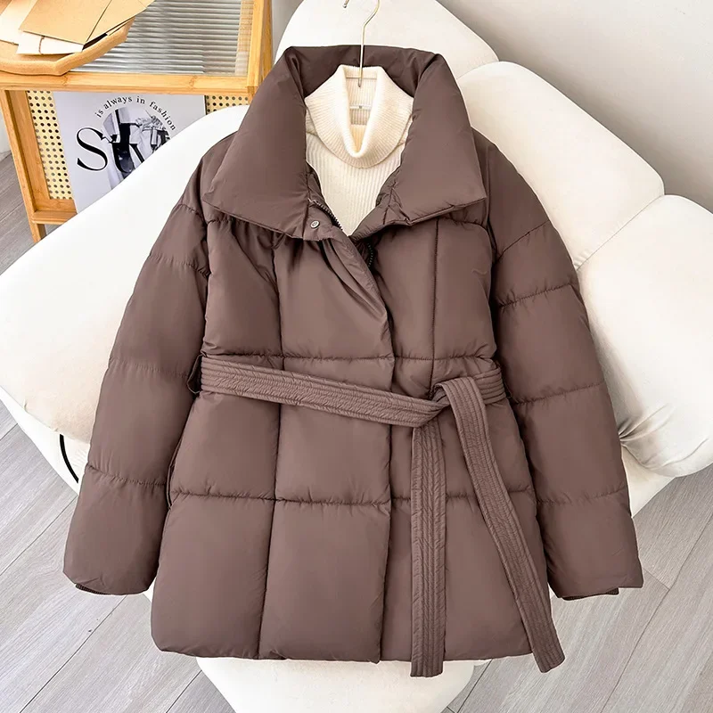 Korean Version of The New Medium Long Loose Stand Collar Down Jacket with Belt, Women Winter Solid Color Warm Zipper Padded Coat