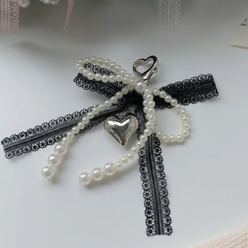 Einfacher Schleifenanhänger aus Legierung, Spitze, Kunststoffperle, Schlüsselanhänger, weiße geflochtene Kette, hängender Schlüsselring, Auto – Detail 9