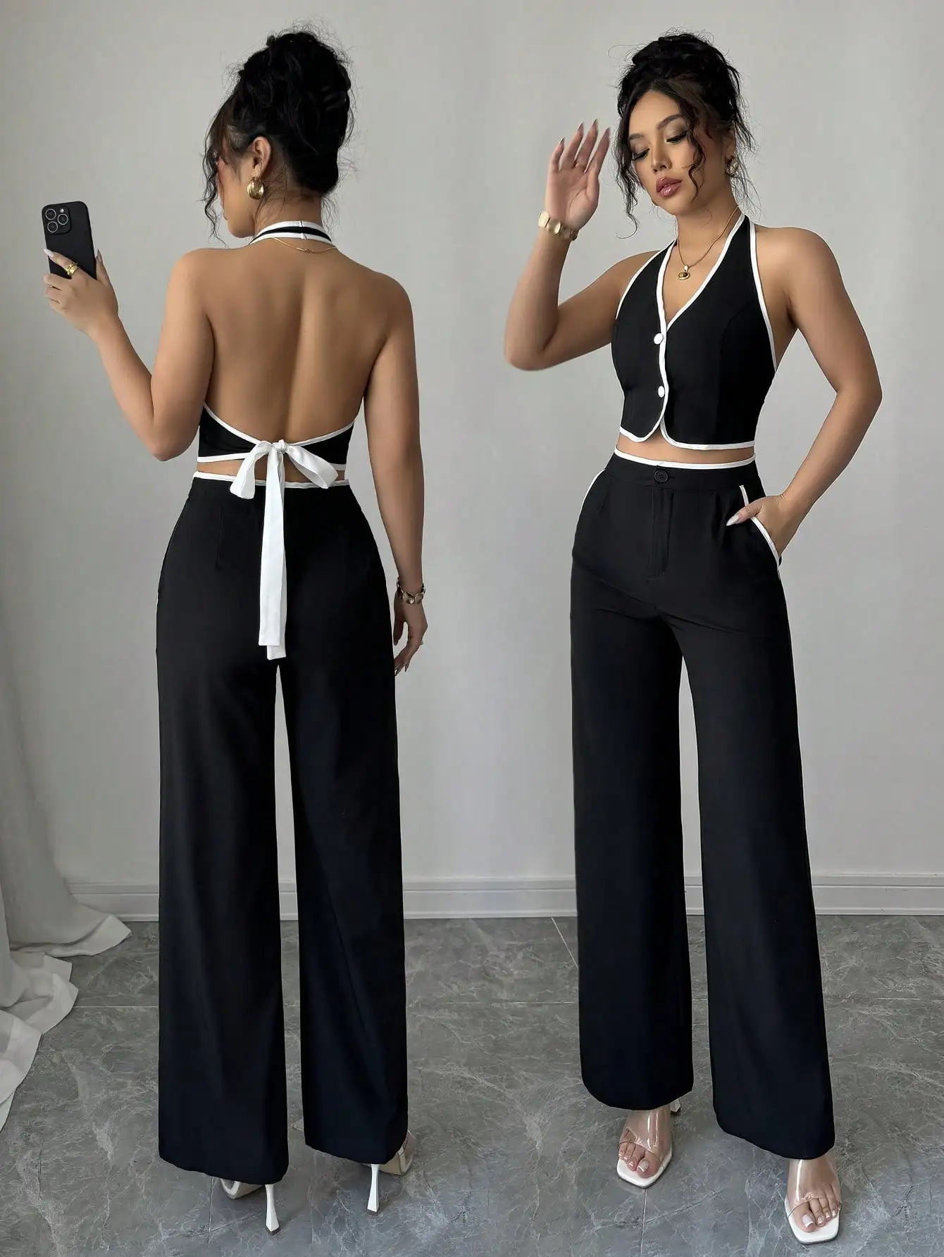 

Женский комплект: черно-белый топ-халтер с завязками сзади и брюки с широкими штанинами