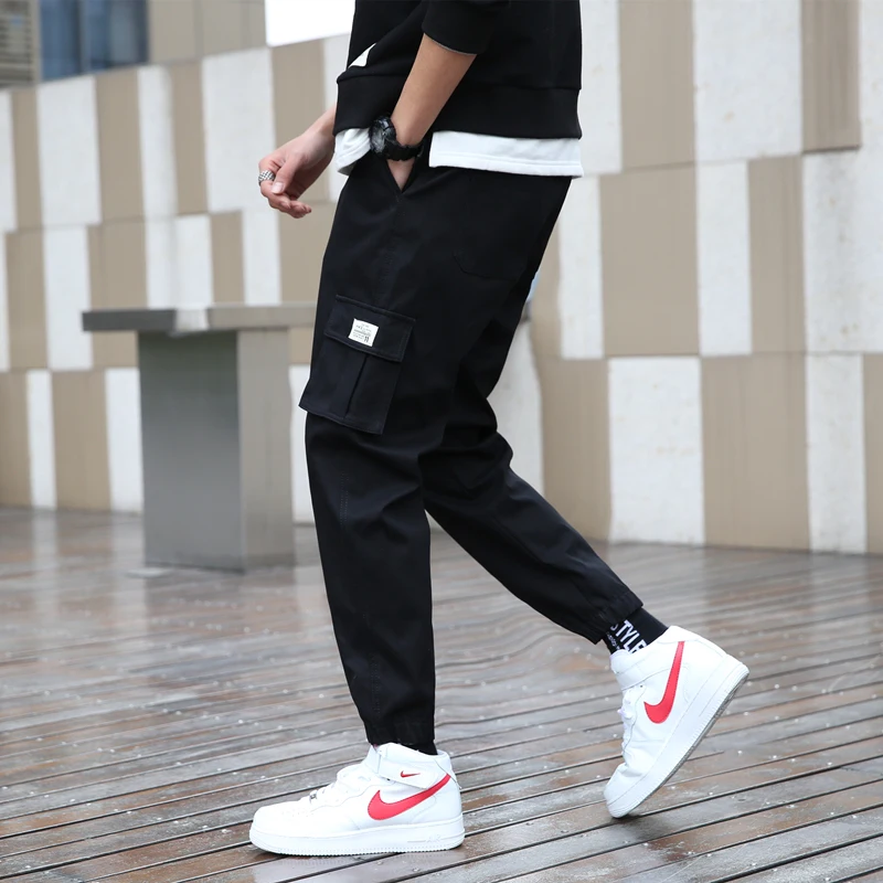 男性用カジュアルワークウェアパンツ 秋 薄手 ゆったり カフ付き トレンド 春夏 コットン ロングパンツ 若者 アクティブスタイル 旅行