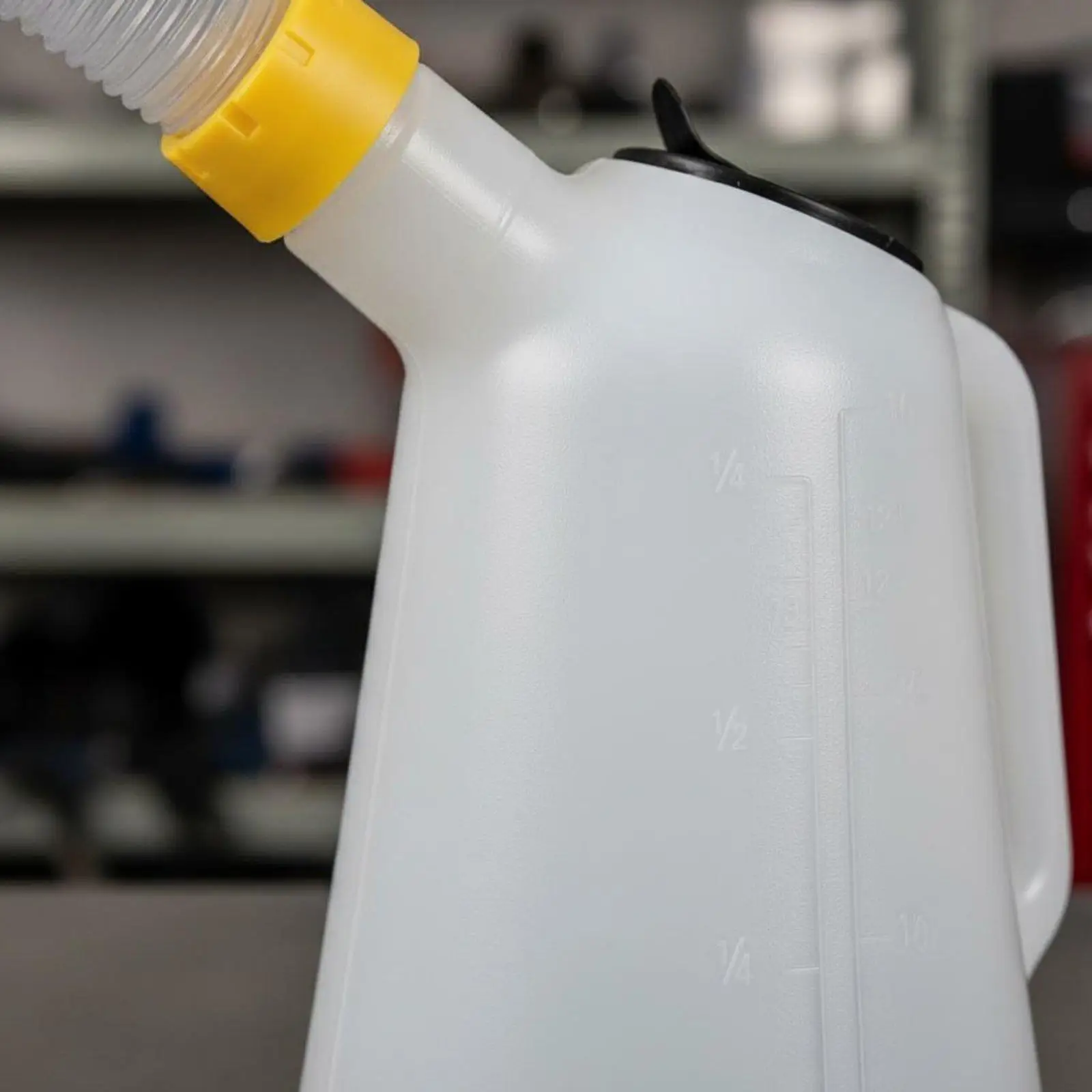 Ergonomic Oil Dispensing Container with Flexible Extension Tube for Reaching Tight Spots During Car Maintenance