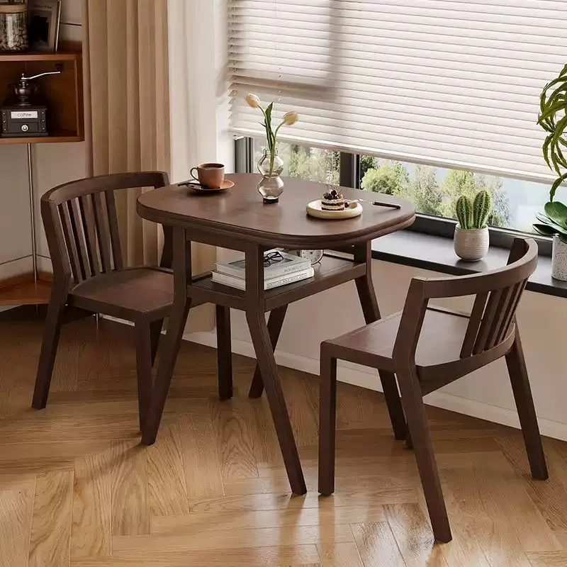 Household small apartment oval dining table balcony table and chairs can accommodate three-piece tea table