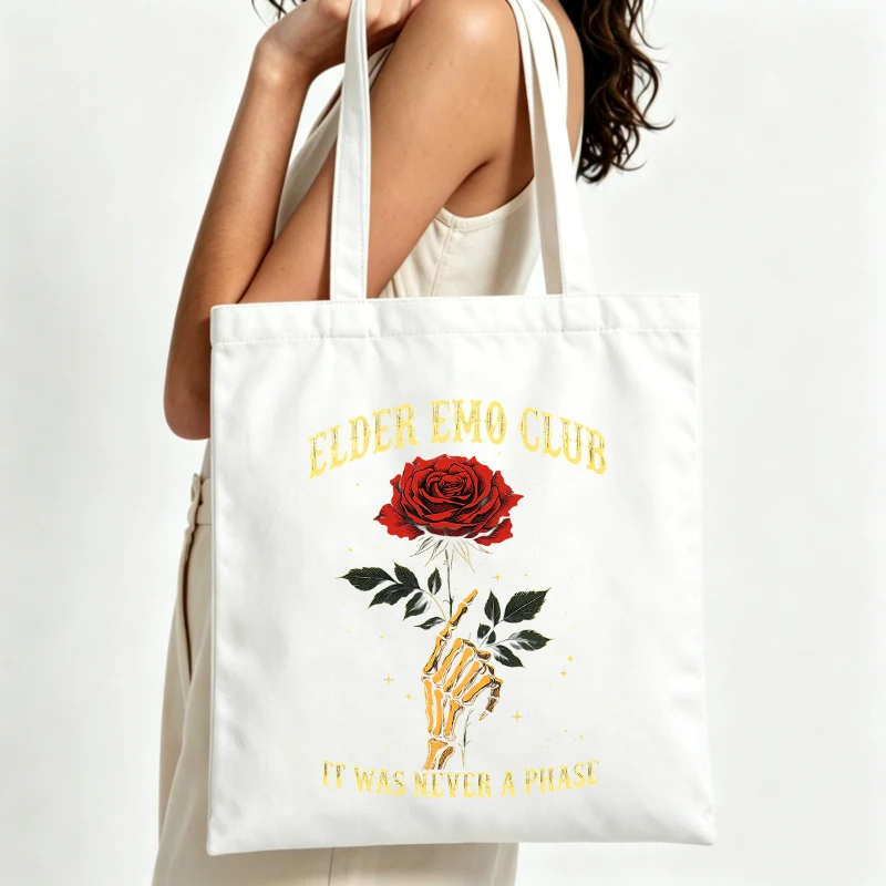 Women's skeleton hand and rose graphic canvas tote bag with slogan print, ideal for casual daily use and street-style outings