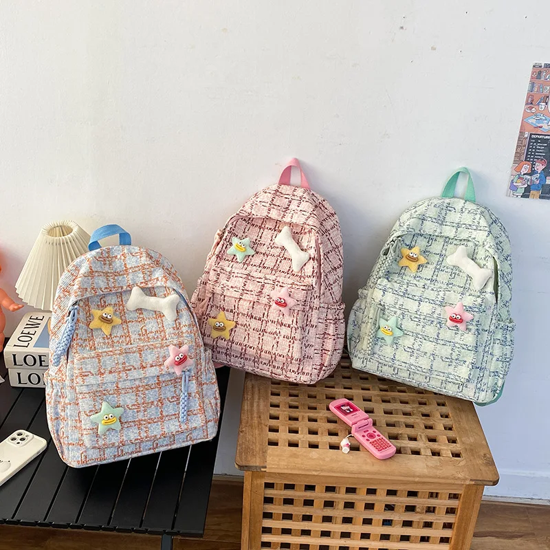 Striped corduroy student schoolbag charm with contrasting colors and large capacity - a cute travel backpack for girls