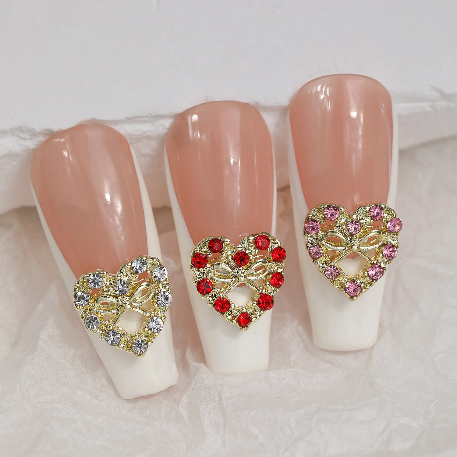 10 pièces 3D alliage de luxe évidé arc coeur Nail Art strass breloques manucure bijoux accessoires ongles décoration fournitures