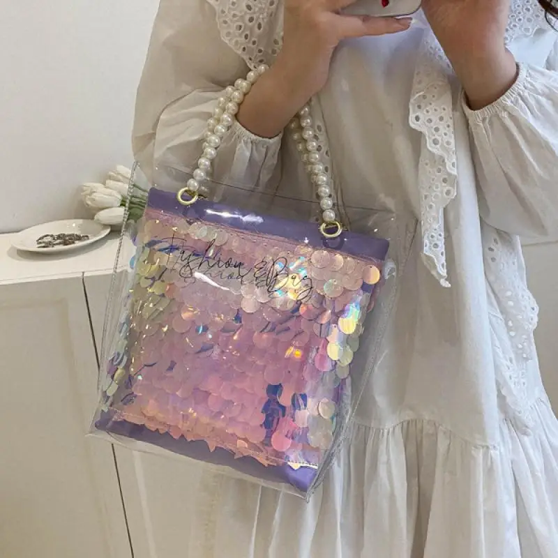 Tas jinjing Laser transparan PVC dengan pegangan atas mutiara untuk wanita tren 2024 tas ember Sequin berkilau dompet selempang