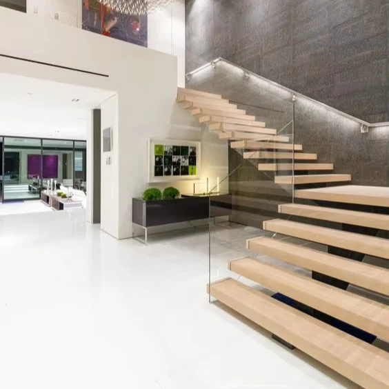 Personalizzazione Scale moderne in granito dritto in acciaio per interni Design gradino in marmo di fascia alta con ringhiera in vetro super bianco