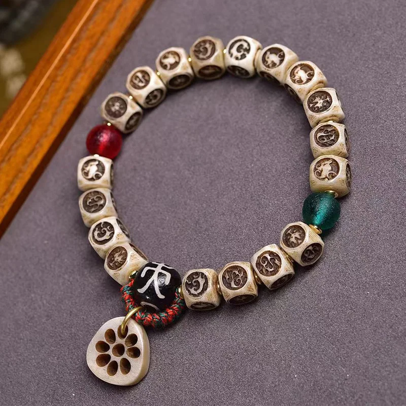 - retro bone-carved Xuan Yin Four Symbols single-loop bracelet, Tibetan-style cultural accessory made of glass and a