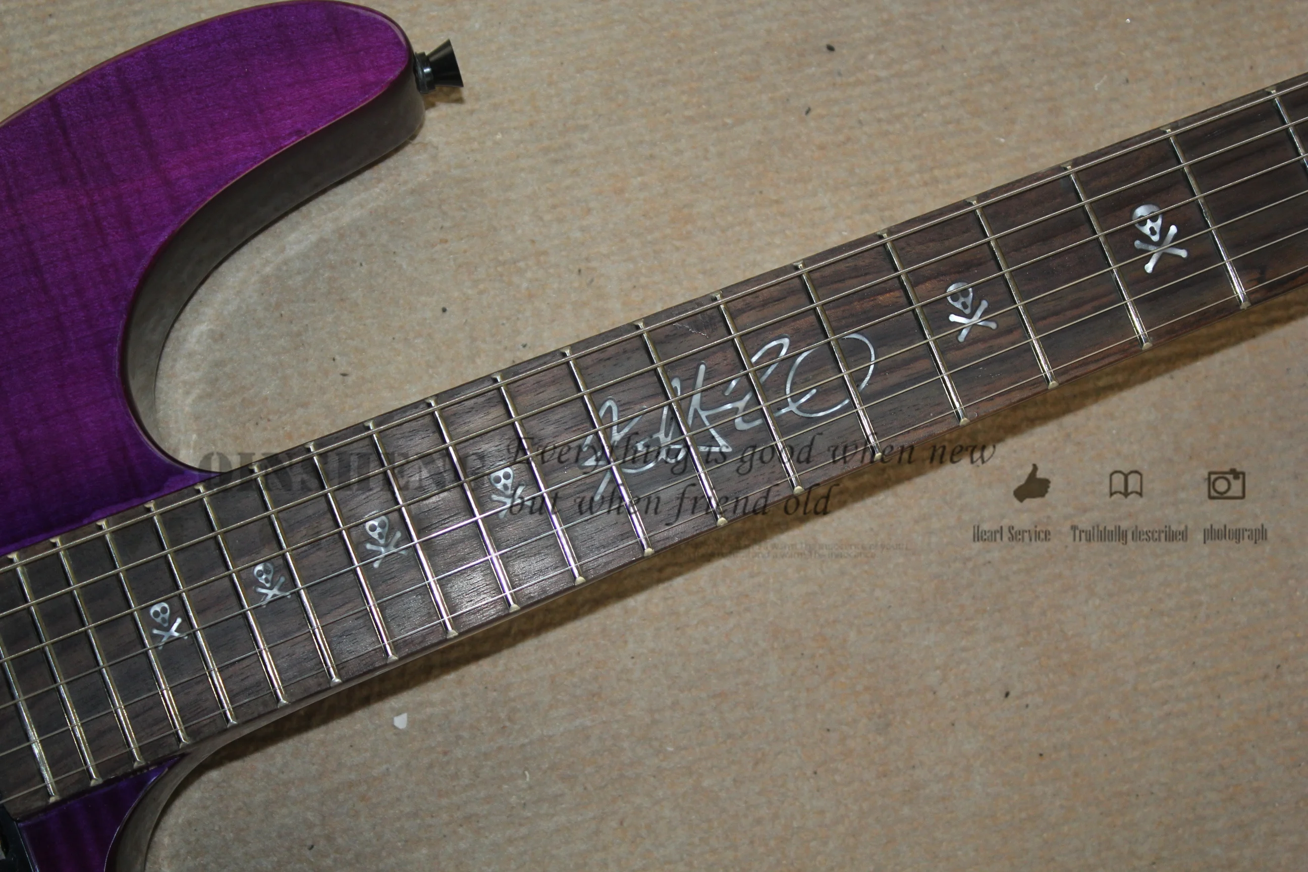 Classic electric guitar, purple guitar flamed maple veneer, vibrato bridge, rosewood fingerboard skull inlay, black button