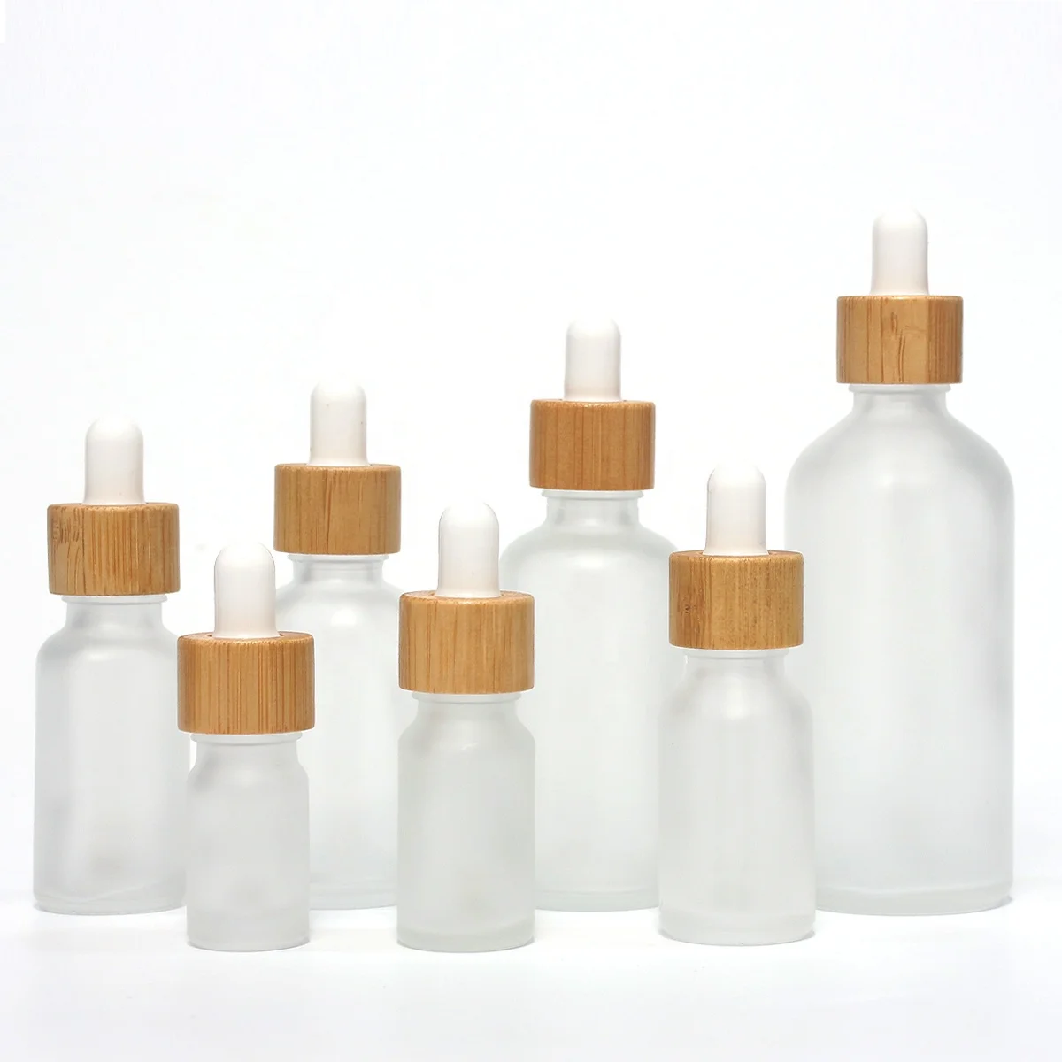 Hot Selling 10ml 30ml Empty Essential Oil Glass Bottle 50ml Transparent Frosted Bamboo Cap Dropper Glass Bottle 50ml 100ml