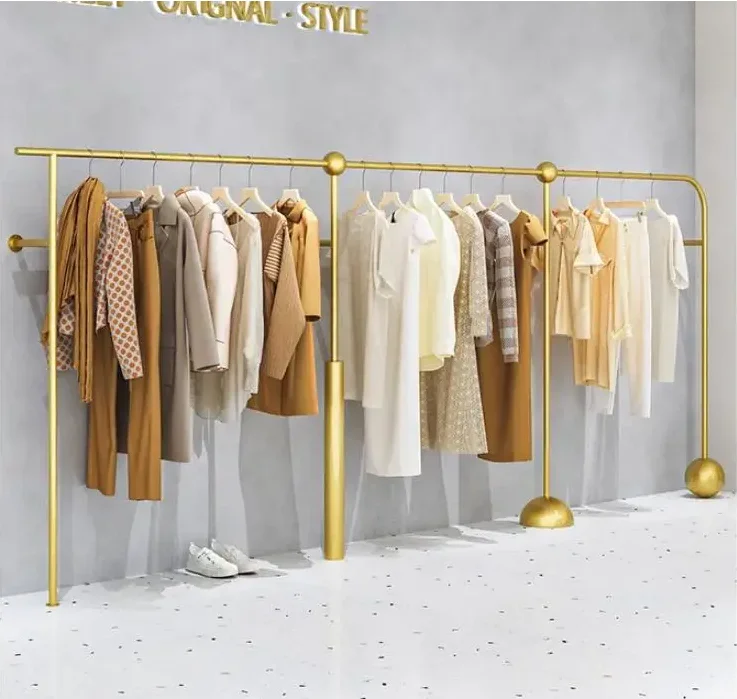 

Women's clothing store shelves display shelves on the wall, gold clothing display shelves, dedicated clothing store hangers