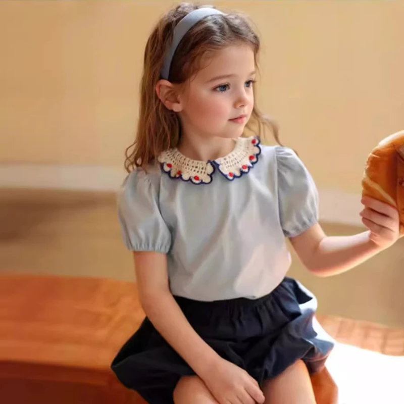 

2025 New Summer T-Shirt for Girls with a Cute Style, Featuring a Crochet Lace Neckline and Short Puff Sleeves for Summer.