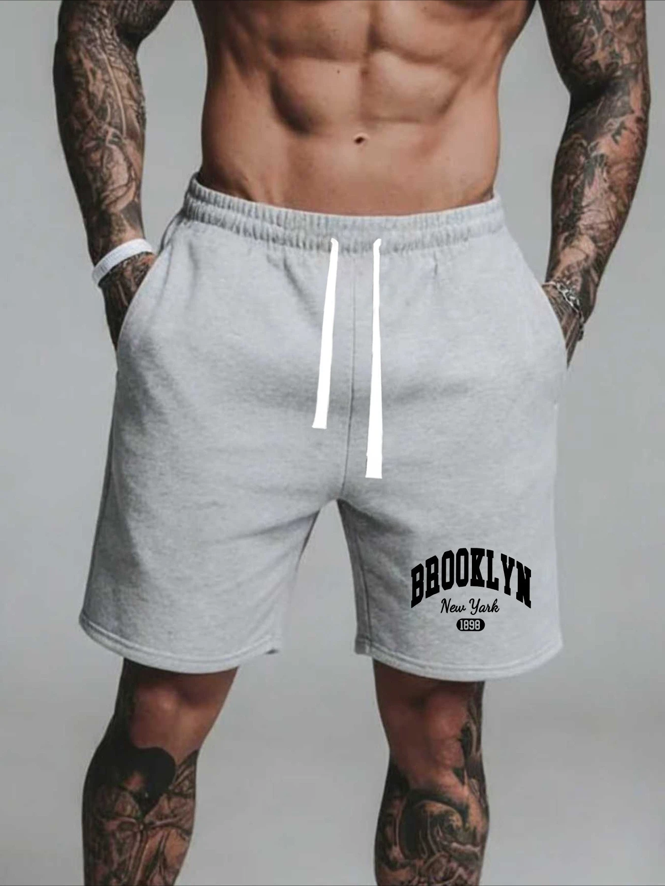 

Мужские летние повседневные шорты с буквенным принтом, свободного кроя, с эластичным поясом и шнурком, подходят для активного отдыха и повседневной носки.