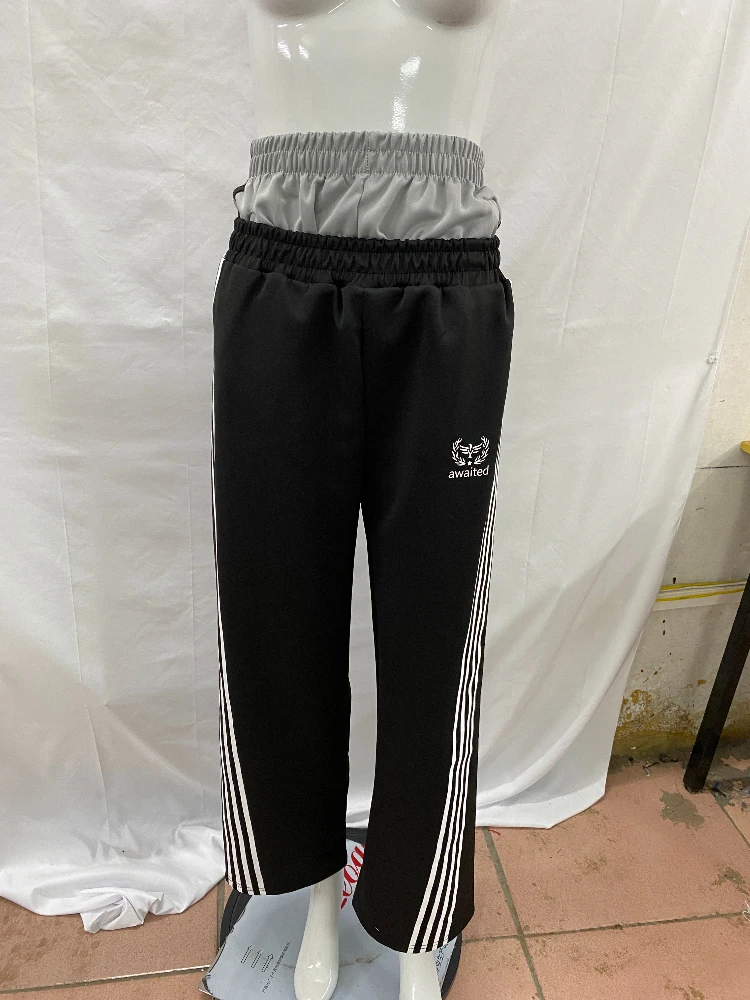 Double waisted fake two-piece long pants with dark Gothic embroidery pattern, color blocked fashionable couple