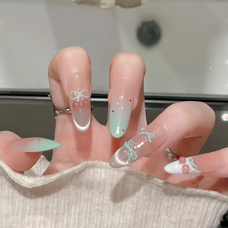 

24PCS Gentle Light Green Gradient Cat Eye French False Nail with Sweet Cherry Bow Fake Nails for Girls Long Almond Press on Nail