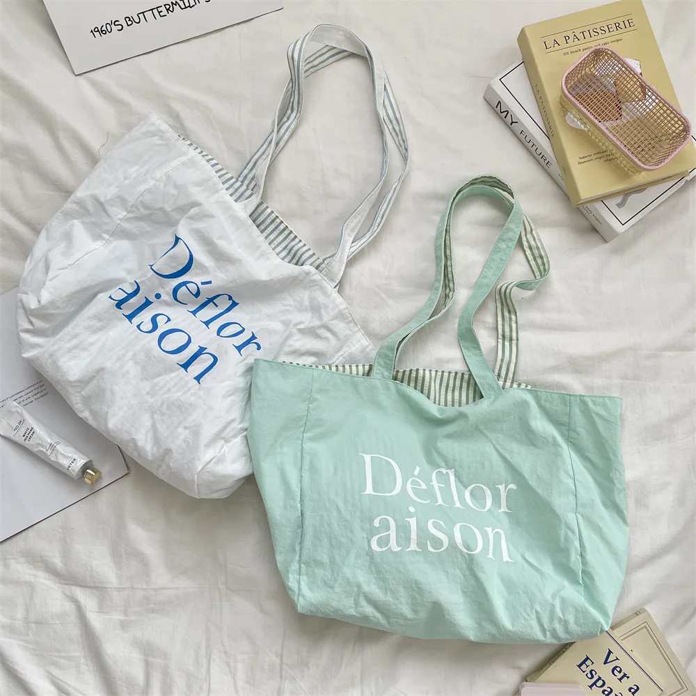 Sac fourre-tout double face Dopamine, trousse de maquillage pour rouge à lèvres, sac de voyage décontracté à bandoulière simple, sac de rangement pour lettres colorées rayées