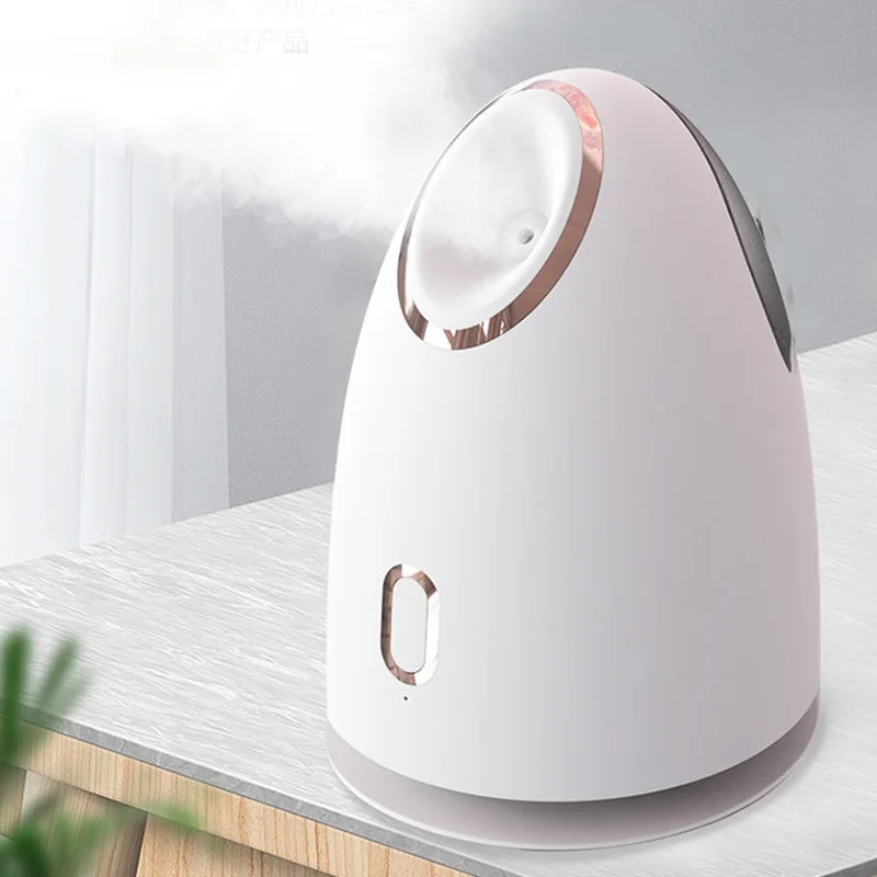 Il detergente profondo per la pelle dell'evaporatore facciale portatile per uso domestico adotta un impacco caldo di bellezza per la cura personale della nanotecnologia