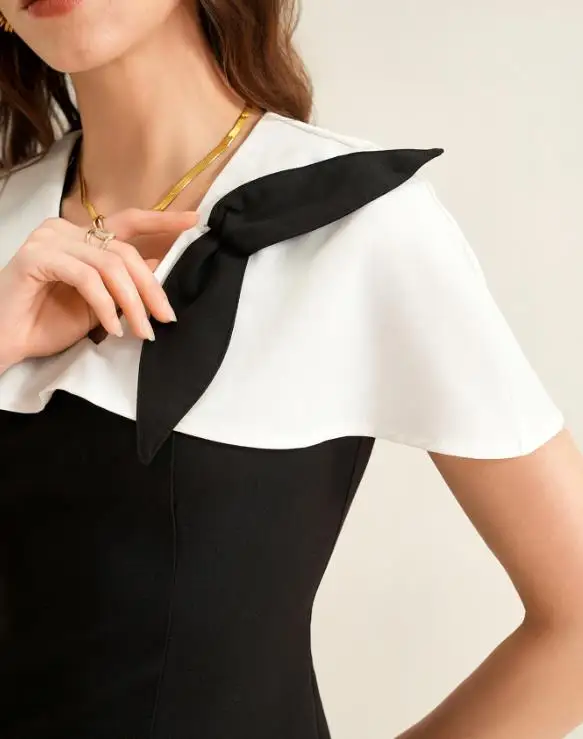 قطعتين مجموعة النساء الزي 2026 ربيع جديد أنيق أبيض وأسود التباين جولة الرقبة تي شيرتات قصيرة الاكمام و سراويل تقليدية مجموعة