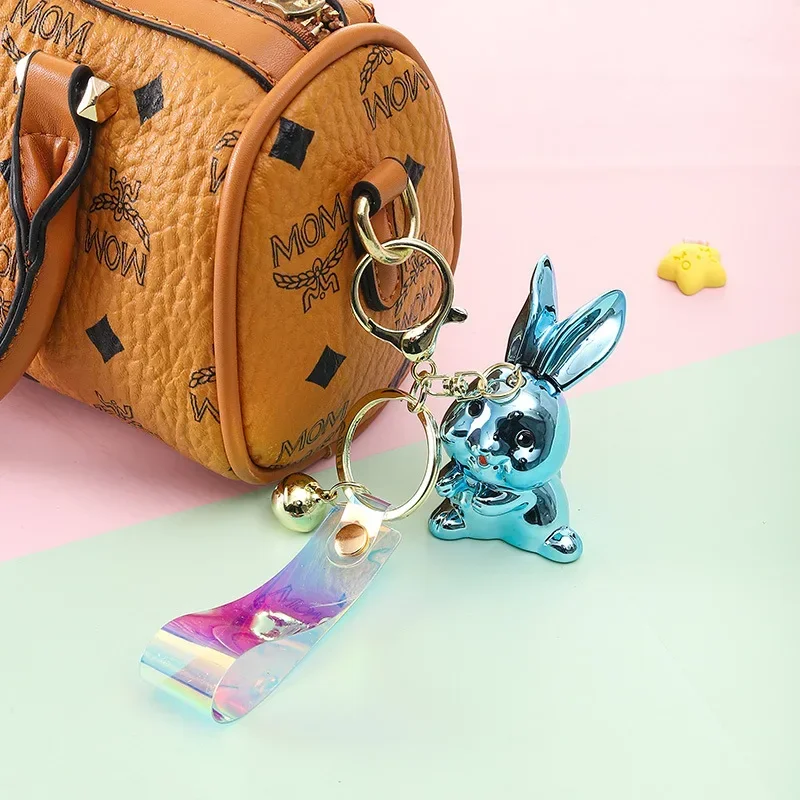 2025 This Miniso electroplated rabbit key chain pendant, a car key accessory, is a cool, cute and exquisite bag pendant