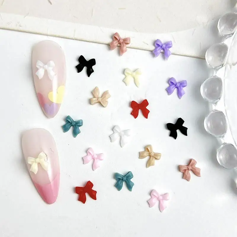 100PCS 3D เรซิ่นหวาน Mini Bowknots ตกแต่งเล็บ Kawaii สีทึบริบบิ้น Bows เล็บ Charms อุปกรณ์สําหรับเล็บ DIY