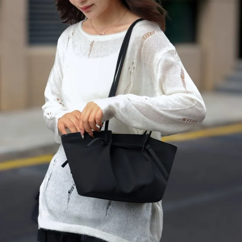 

Modern Architectural Structured Bag For Women With Geometric Lines And Premium Leather Material