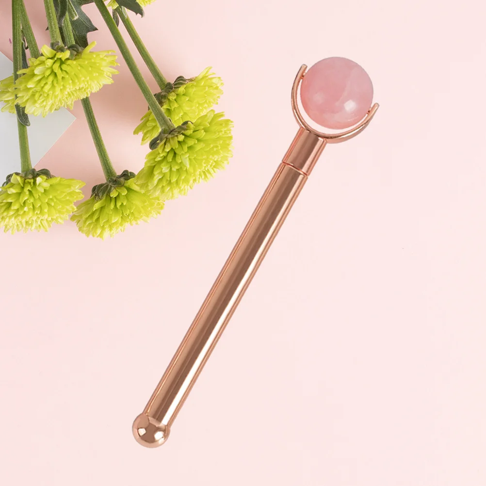 ลูกกลิ้งหยกเครื่องมือนวดหน้า ลูกกลิ้งสีชมพู ด้ามจับโลหะสีโรสโกลด์ นวดดูแลผิวที่สะดวกสบาย ต่อต้านริ้วรอย บรรเทาความเมื่อยล้า