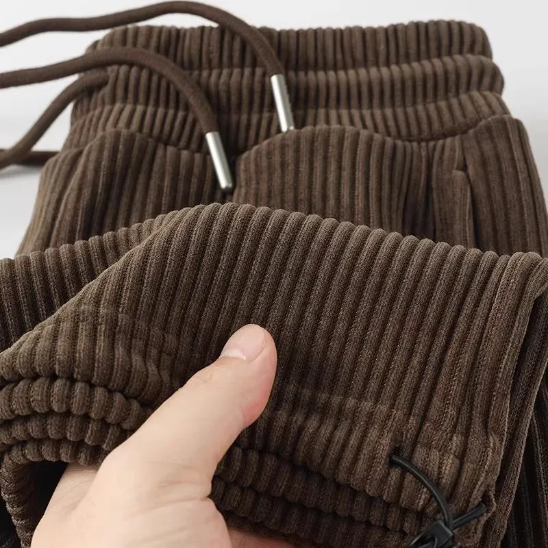 

Вельветовые брюки унисекс: мужские и женские, свободного кроя, с завышенной талией на резинке, прямые штанины, повседневные, цвет коричневый.