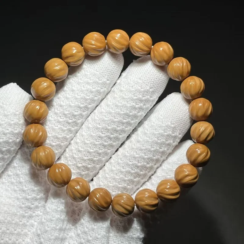 Premium walnut monkey bracelet, featuring a full-grain leather carving with a pattern