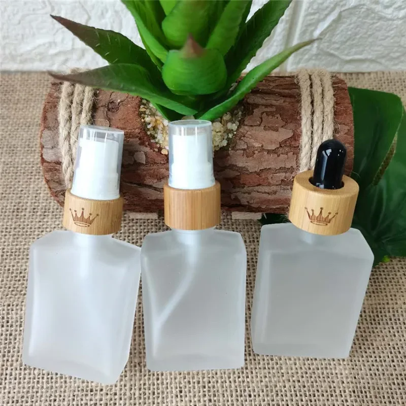 

high grade square custom logo colourful square dropper bottles bamboo lid Clear Glass Essential Oil Bottles hair oil container