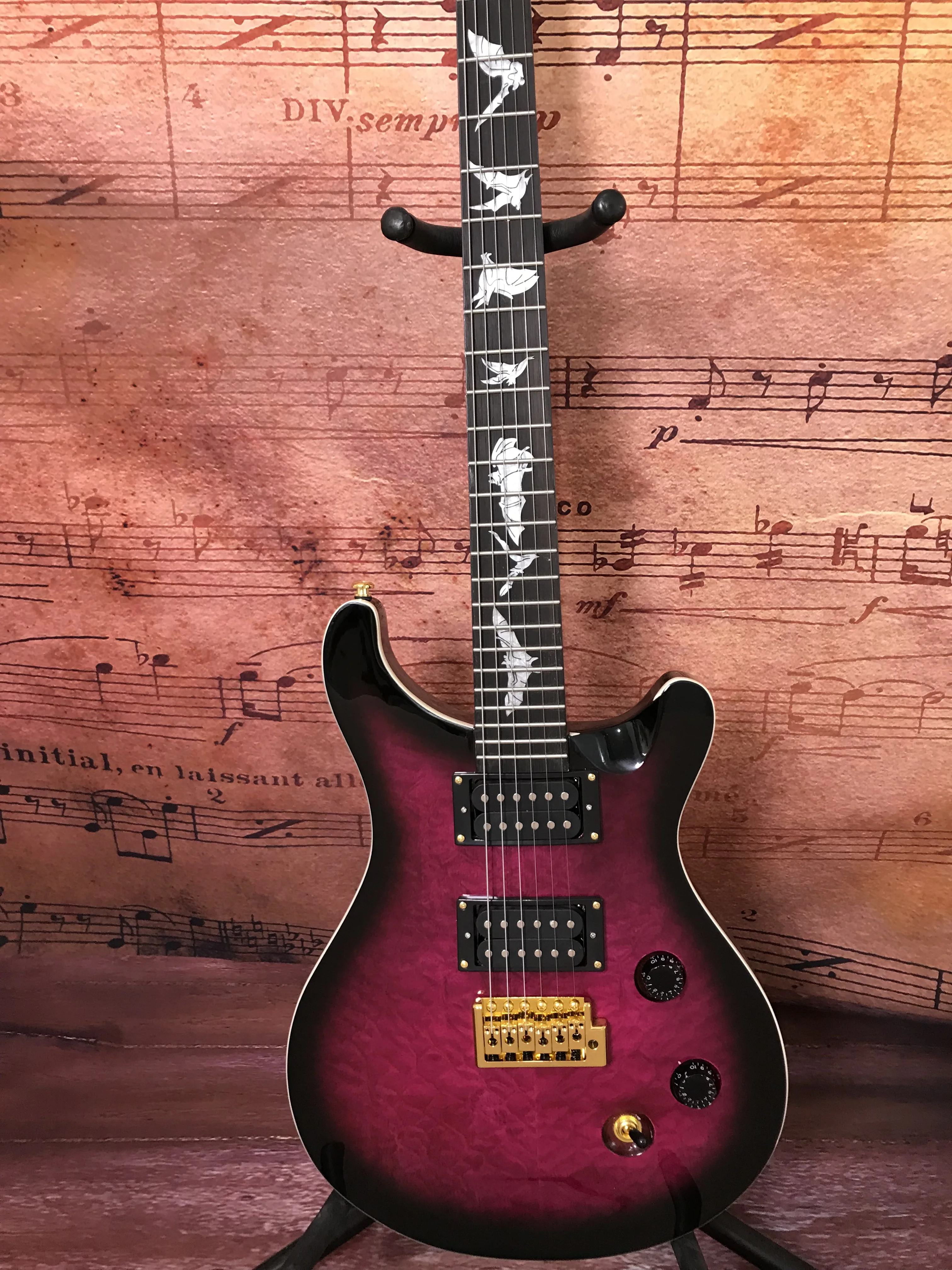 

Chinese 6-string purple color electric guitar bat inlays mahogany neck High quality and low price hot sale