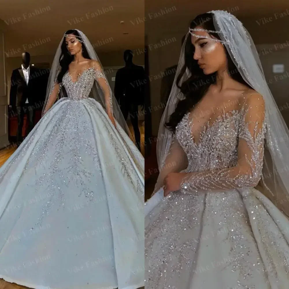 Personnalisé luxueux nouveau 2025 robes de mariée africaines col transparent manches longues robes de mariée perles paillettes robes de mariée en satin