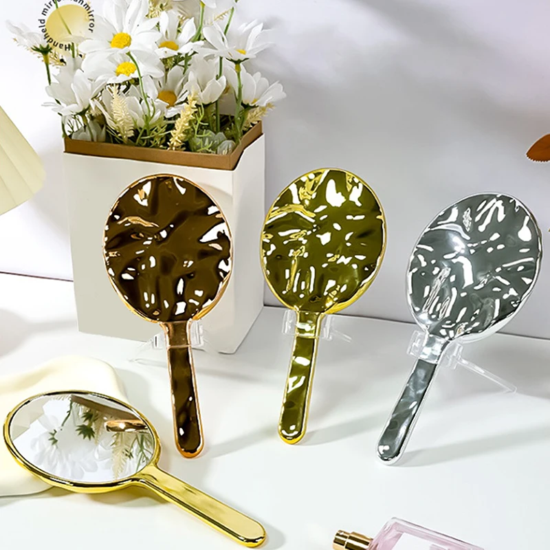 Vloeibare ellipsofvormige spiegel Handbediende desktop cosmetische make-upspiegel Reizen Draagbare schoonheid Glanzende zilveren spiegel voor handtas