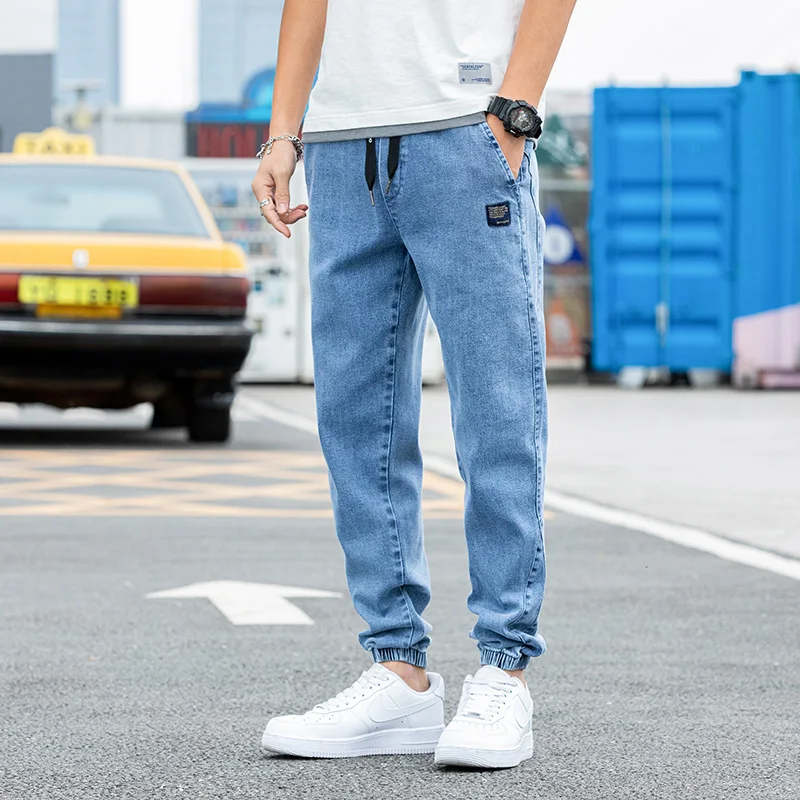 Nowe Duże Rozmiary 8XL Męskie Jeansy Jogger Streetwear Czarne Niebieskie Casualowe Spodnie Cargo Denimowe Elastyczne Bawełniane Spodnie Taper Jeansy Luźne Spodnie