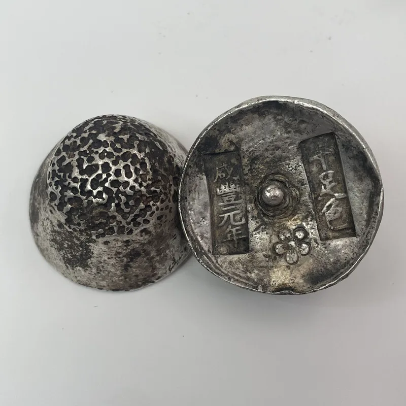 Miscellaneous items five pieces of silver ingots a honeycomb-shaped base decorated with sharp points