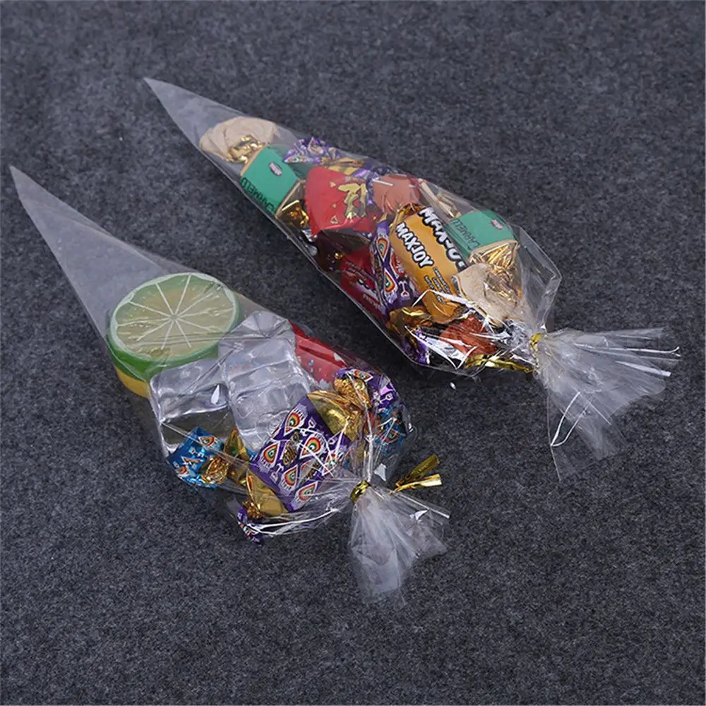 Bolsa de embalaje de celofán transparente con lazos giratorios, cono de caramelo para fiesta de bodas y Halloween, flor de Chocolate útil, 50 piezas