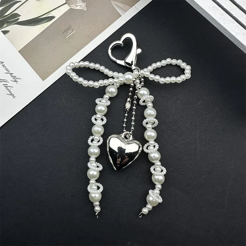 حقيبة جديدة على شكل فيونكة لؤلؤية على شكل قلب مصنوعة يدويًا لحقيبة الهاتف وحقيبة الملابس والأحذية وإكسسوارات الحقائب