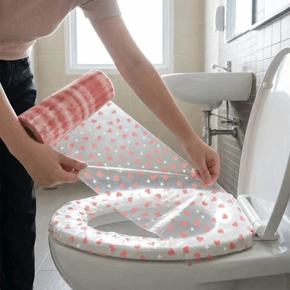 Heart Print Disposable Toilet Seat Covers Waterproof Film Material Adhesive Strips Hygienic Toilet Seat Covers Heart Pattern